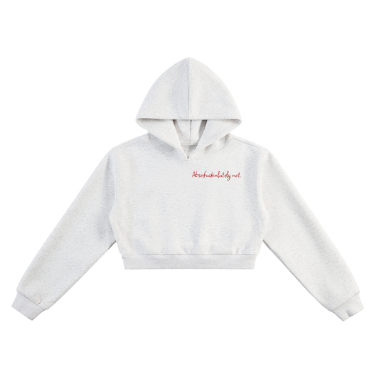 White cropped hoodie with a brand logo on a white background