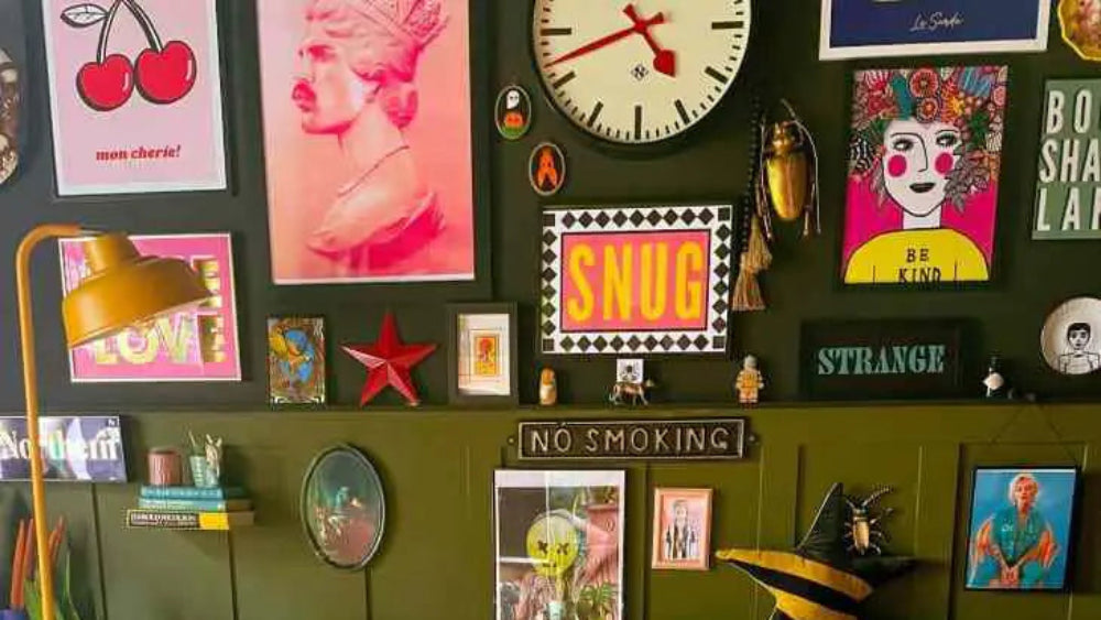 Colorful living room with a green sofa, decorative pillows, and wall art.